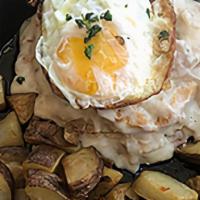 Biscuits And Gravy · Italian-style biscuits and gravy. Homemade buttermilk
biscuit topped with locally sourced sp...