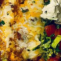 Smothered Burrito · Smothered green chili burrito with homemade chorizo,
eggs, potatoes, and cheese. Serviced wi...