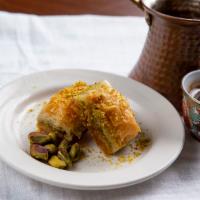 Turkish Baklava · Served with layers of very flaky, thin pastry leaves and pistachio nuts.