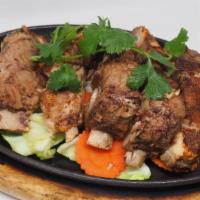 Garlic Pork Rib · Marinating and slow cooking to perfect soft and tender, topped with garlic sauce& vegetables.