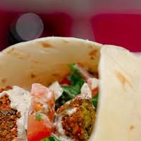 Falafel Wrap · Falafel (Vegan) Wrap with fresh made naan bread-Lettuce-Tomato-Onion-Cucumber and Ranch sauce