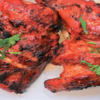 Tandoori Chicken Kebab · Serve with: Basmati Rice, Chana Masala & Naan Bread.

Halal. Two pieces. Leg and thigh marin...