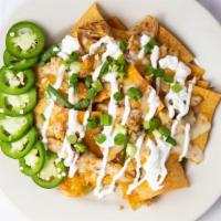 Nacho Platter · Crispy corn chips covered with a la charra beans, melted cheese and jalapenos, served with s...