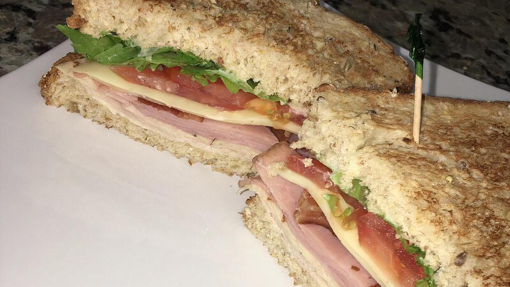 City Club Classic · Turkey, ham and bacon, American cheese, lettuce, tomato and mayo on toasted sourdough or plain wrap.
