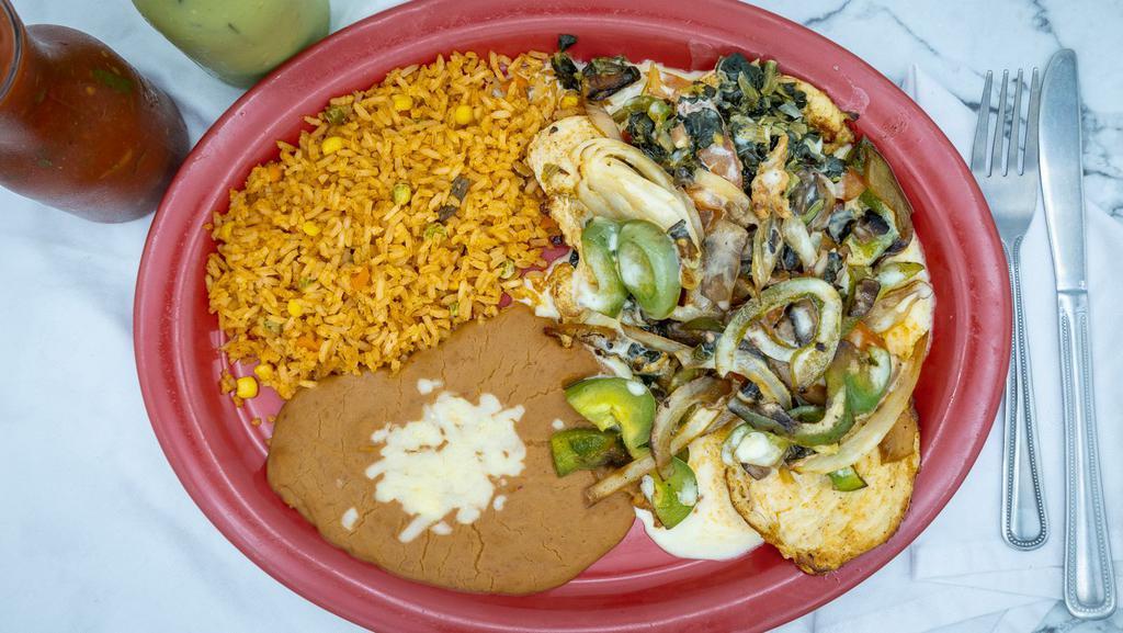 Pollo Al Manhattan · Grilled marinated boneless chicken breast, covered with fresh sliced mushrooms, spinach, bell peppers and onions, smothered with our special cheese sauce. Served with rice and beans.