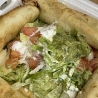 Flautas · Four deep-fried, rolled corn tortillas, stuffed with shredded beef or chicken and served wit...