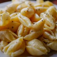 Shells And Cheese · Warm pasta shells in a creamy white cheddar cheese sauce.