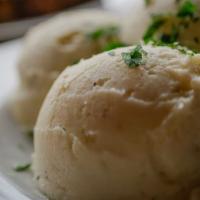 Mashed Potatoes · Smooth and buttery mashed Russet potatoes.

(V)