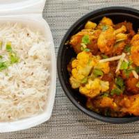 Aloo Gobi · Vegan. Sautéed cauliflowers and potatoes cooked with ginger, garlic, onion, tomatoes, and sp...
