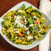 Palak Chaat · Fresh crunchy baby spinach bits of fresh tomatoes,  onions all tossed in the flavorful mixtu...