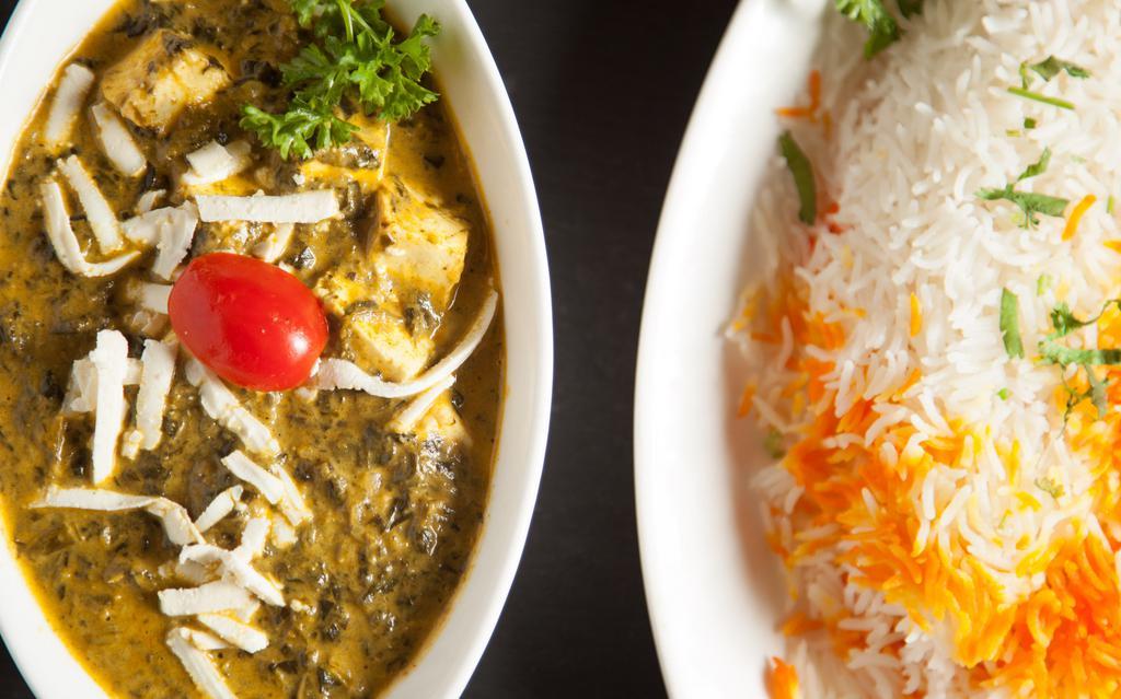 Palak Paneer · Homemade farmer's cheese cubes, spinach cooked in green herbs and spice.