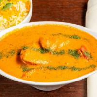 Murgh Makhini · Barbecued chunks of boneless chicken breast meat cooked in fresh cream, based tomato curry s...