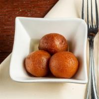 Gulab Jamun · Dry milk balls with honey sauce.