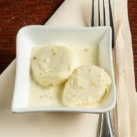 Ras Malai · Cottage cheese dumpling served in a creamy sauce.