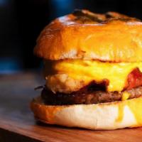 The Ultimate Beggelwich · A Toasted, Buttered Bagel with Eggs, Sausage, Bacon, Hash Browns & American Cheese