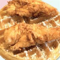 Connies Buttermilk Waffle With Chicken Breast Tenders · Two chicken breast tenders and a buttermilk Belgian waffle with maple syrup.