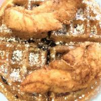 Connies Oreo Cookie Waffle With Chicken Breast Tenders · Two chicken breast tenders and a oreo cookie Belgian waffle with maple syrup and powdered su...
