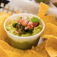 Guac On The Spot · Tortilla chips with freshly-made guacamole