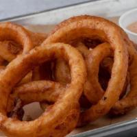 Onion Rings · Beer-battered rings fried until golden brown and served with BBQ Ranch dipping sauce