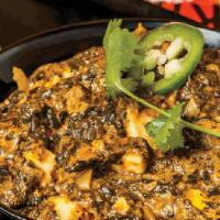 Saag (Gf) · Pureed spinach sauteed with garlic and onions, delicately spiced and enriched with cream. Se...