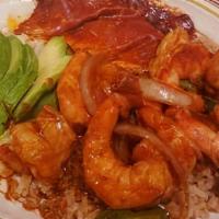 Shrimp A La Veracruz · Shrimp sautéed in a Chile ancho sauce with bell pepper and onions. Served on a bed of Mexica...