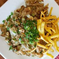 Guay Tiew Kua Gai · Vegan.  Wide size rice noodles with chicken,  egg,  green onions,  cilantro. topped with fri...