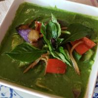 Green Curry · Mild spicy. Gluten free.  Choice of meat in green curry paste and coconut milk with eggplant...