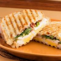 Croque Americaine - A Breakfast Panini · Sliced egg, crisp bacon, pepper jack cheese, tomato, lemon aoli and watercress grilled on ou...