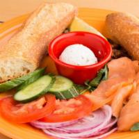 Smoked Salmon Platter · Our French  ficelle, smoked salmon, house-made dill spread, tomato, red onion, cucumbers, ca...