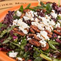 Cranberry Goat Cheese Salad · Mixed greens and arugula tossed in cranberry vinaigrette, topped with candied pecans, dried ...
