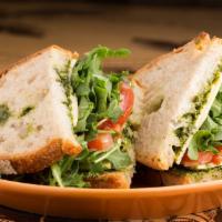 Homemade Basil Pesto & Gouda Cheese · With tomato and arugula served on Country Levain bread.