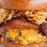 Gus'S Famous Burger · cheddar cheese, applewood smoked bacon, shredded onion strings, original bbq sauce, roasted ...