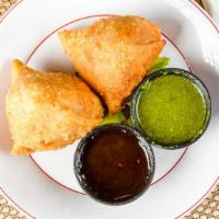 Meat Samosas (2 Pcs) · Minced seasoned chicken, wrapped pastry.