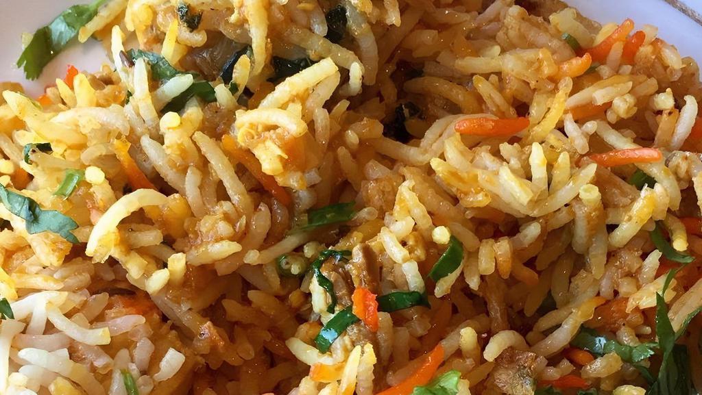 Royal Karma (Biryani Special) · Baked casserole of basmati rice and lamb, chicken, shrimp, vegetable with saffron, biryani masala.
