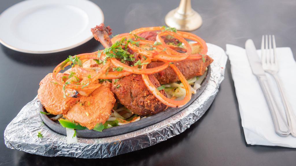 Special Kabob Platter · Chef’s special. Kabob samplings: tandoori chicken, chicken tikka, malai tikka, chicken and lamb seekh kabob, and tandoori shrimp.