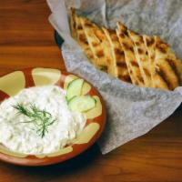 Tzatziki · Cucumber and Greek yogurt dip seasoned with garlic, dill and lemon juice.**