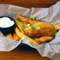Greek Potatoes · Potato wedges lightly fried and served with our zesty garlic sauce.