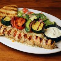 Chicken Kabob · Served with rice, grilled vegetables, salad, pita bread and tzatziki sauce. Choice of regula...