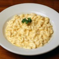 Mac & Cheese · Macaroni tossed with a creamy cheddar cheese blend.