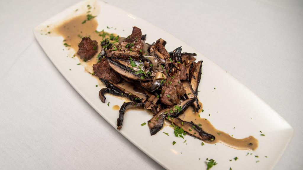 Grilled Portabella Mushrooms · Marinated then grilled and served with trattoria zip sauce. Add beef tips for an additional charge.