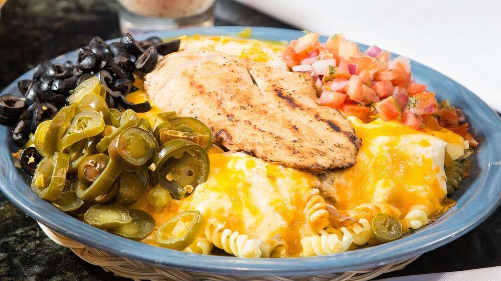 Fajita Pasta · Choice of Queso, fundido cream cheese, red gravy, or seafood gravy.
And choice of fajita chicken, beef or shrimp.
Topped with sautéed green peppers and onions, olives, jalapeños, pico de gallo.