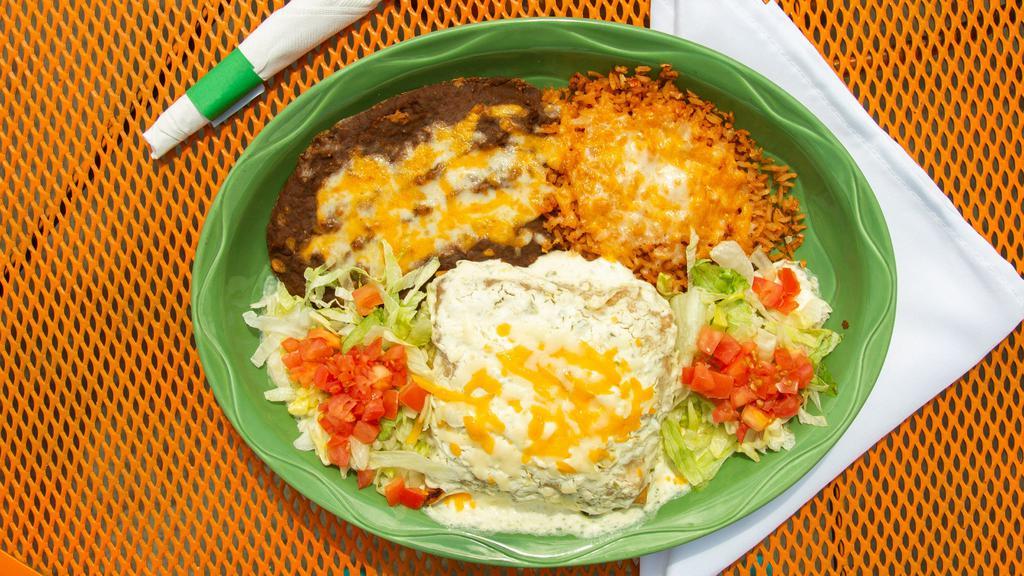 Pollo Fundido · Shredded chicken chimi topped with jalapeno cream cheese, lettuce and tomato. Served with rice and beans.