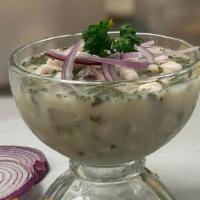 Ceviche Peruano · Diced Tilapia marinated in lime juice.