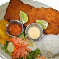 Chuleta Valluna · Filet of pork loin breaded & fried, served with white rice, salad, & green plantains