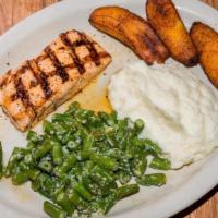 Salmon En Limon Y Mantequilla · Fresh Salmon cooked in lemon butter; served with green beans, mashed potatoes, & sweet plant...