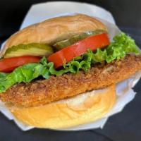 Fried Chicken Sandwich. · Served with Lettuce, Tomato, Pickles, House Garlic Mayo and Chipotle Sauce on a bun.