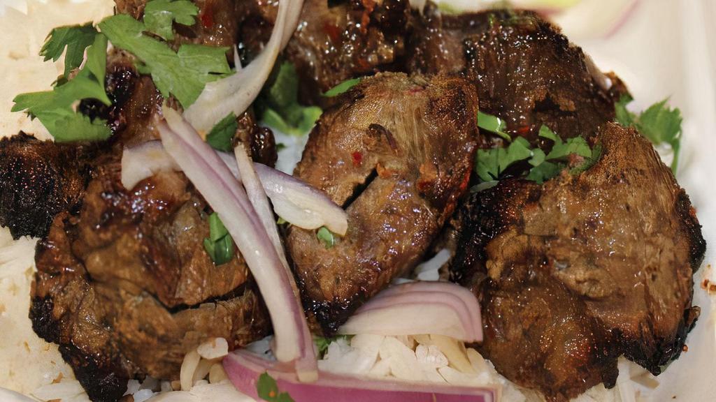 Lamb Kebab · Kabob Special serve with: Basmati Rice, Chana Masala & Tandoori Bread,

Halal. Chank of tenderloin and marinated with special seasoning.