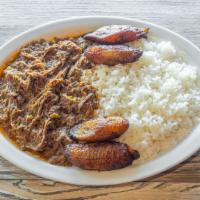 Ropa Vieja · A delicious typical Cuban entreé. Shredded beef in a Cuban tomato based sauce with garlic, o...