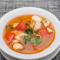 Cup Tom Yum Soup · Mushrooms, tomatoes in a spicy broth with a touch of lemongrass and lime leaves. Medium spicy.