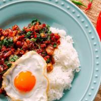 Basil Fried Egg · Medium spicy. Sauteed minced chicken with fresh chili, garlic and basil in light brown sauce...